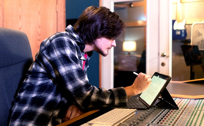 Man working on script in the Nashville Audio Productions Studio