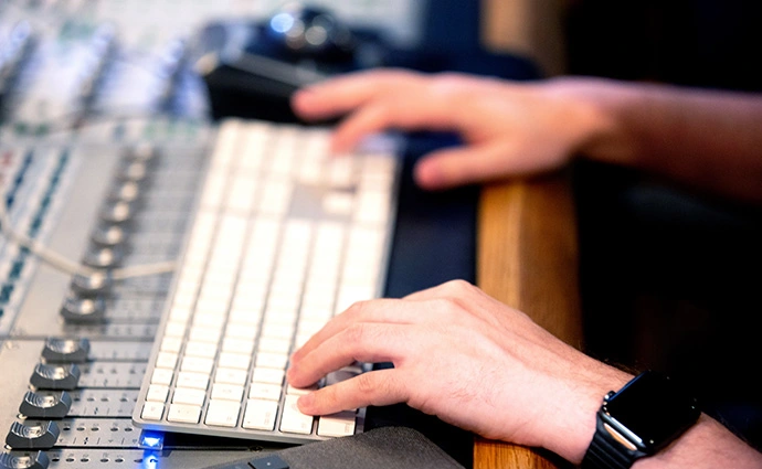 Fingers on Keyboard in the Nashville Audio Productions Studio